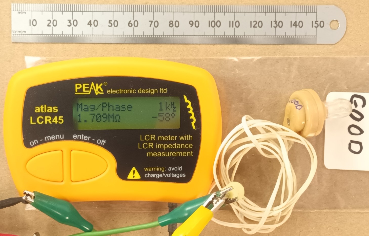 click to enlarge Old construction true piezo
crystal earpiece showing real high impedance at 1 kHz.
