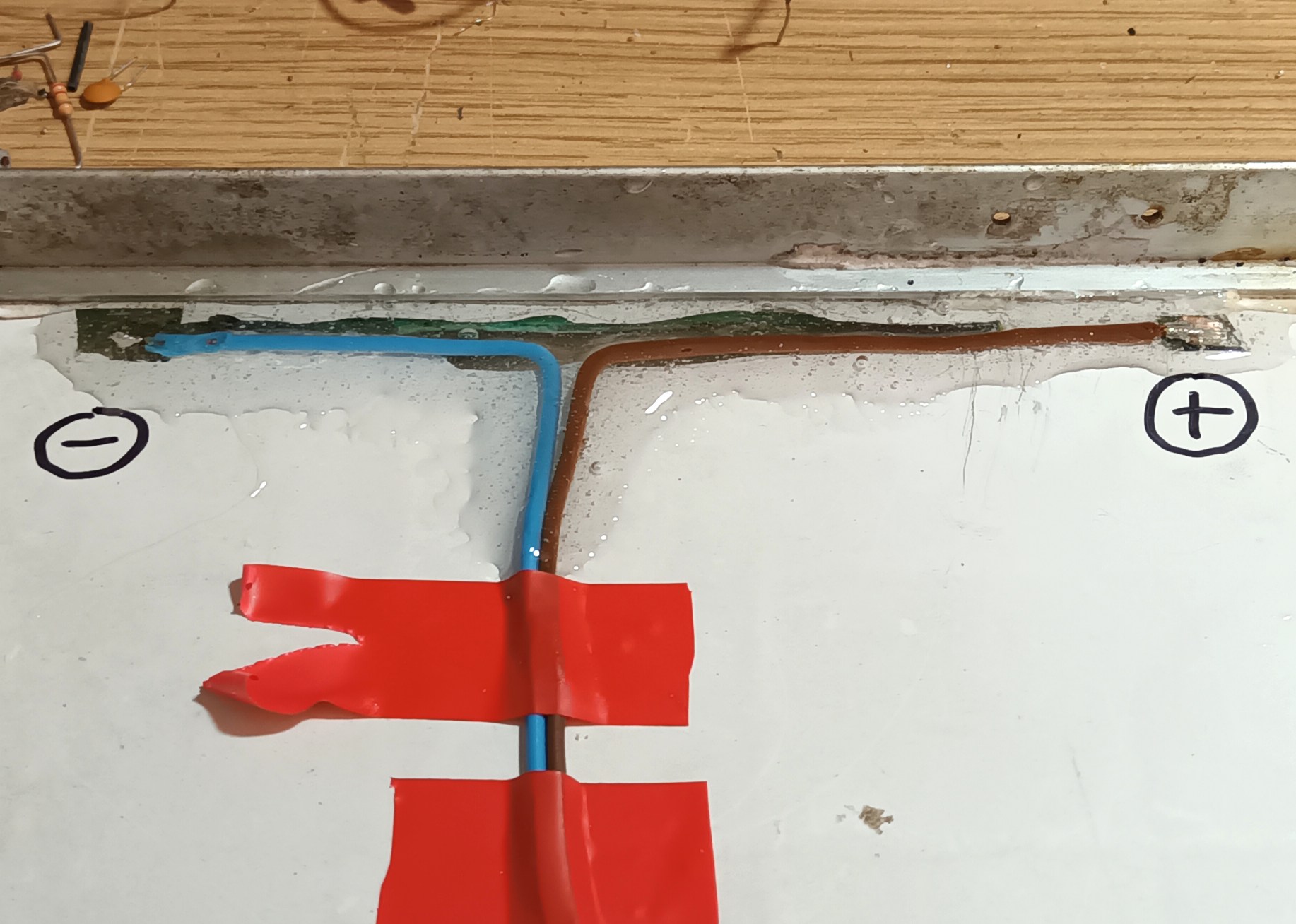 click to enlarge Epoxy Sealing New Wiring On A
Broken 12V Photovoltaic Solar Panel
